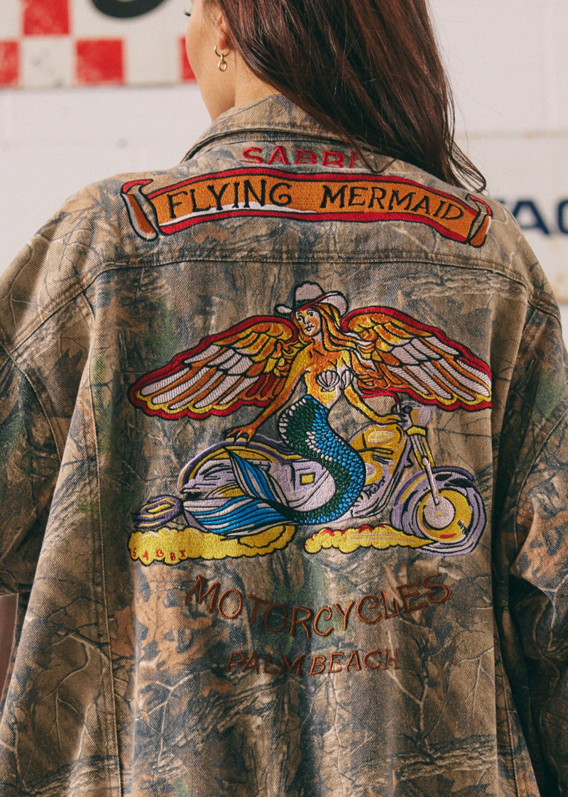 Vintage-style jacket with a mermaid graphic and text on the back